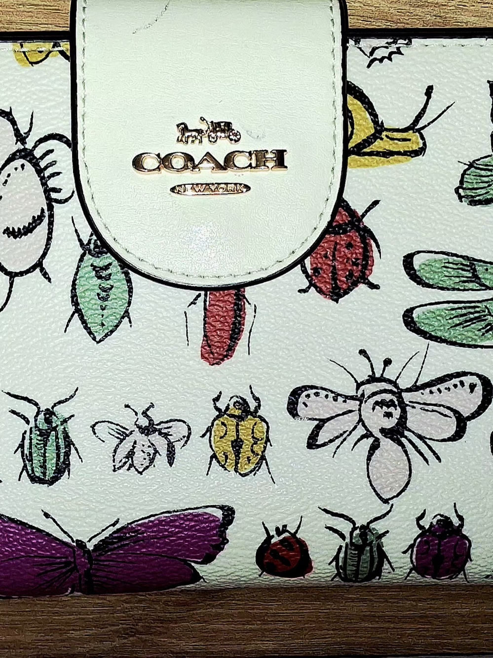 Coach White Leather Wristlet with Colorful Bug & Floral Sketches